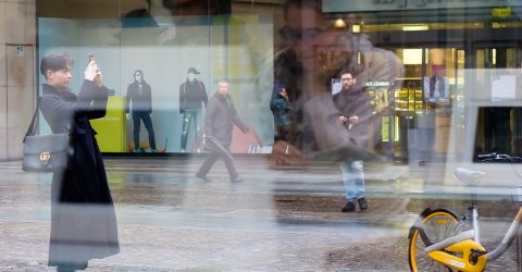 Take a photo of girl in window’s reflection