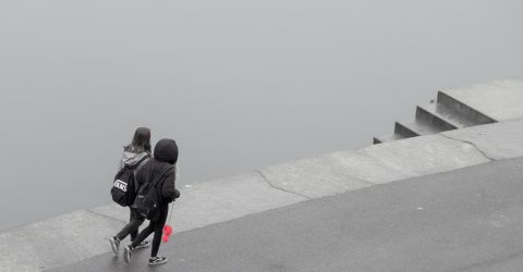 Walking by the river on the rainy day