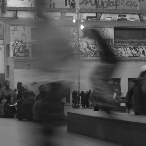 Skateboarder grinding a ledge in MACBA