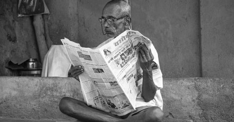 Reading newspaper