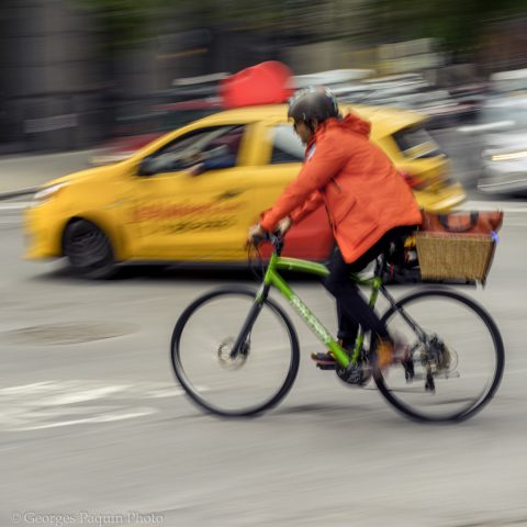 Cyclist and delivery car rushing