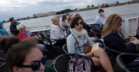 Tourists. Neva River Cruise.