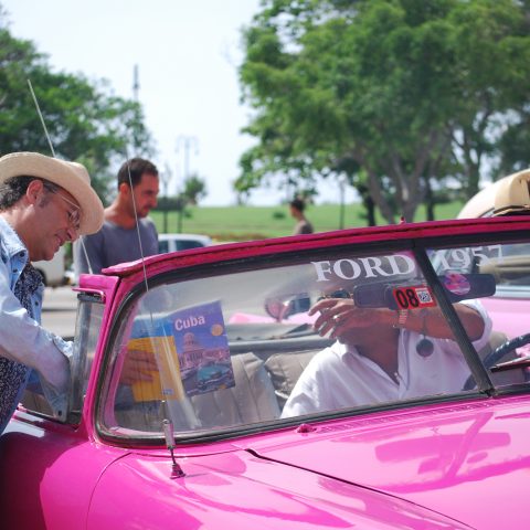 havana street – a taxi driver and a turist