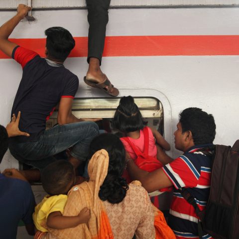 Passengers riding trains through the window for challenging journey-05