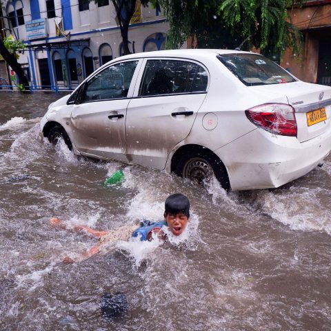 SWIMMING IN WATERLOGGED STREET