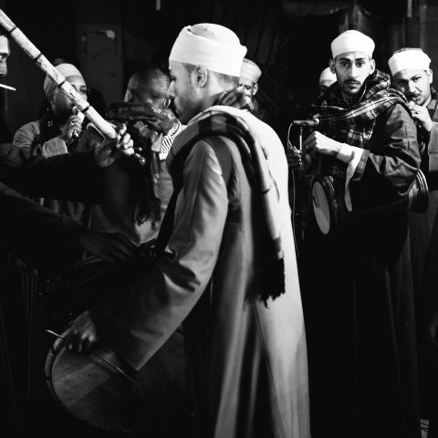 A group of men from southern Egypt dance using the stick