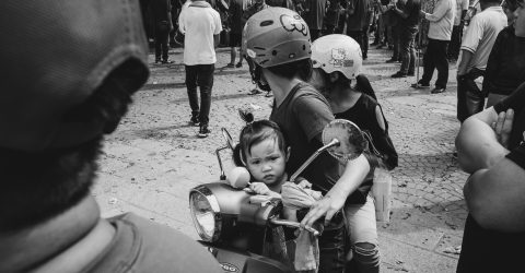 The little girl onthe scooter