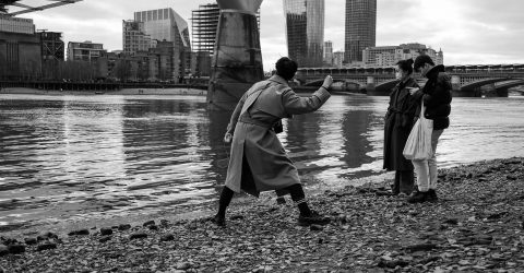 Guys playing with stones on the Thames